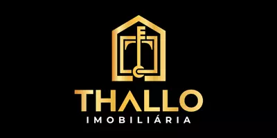 Logo de Thallo Imobiliária 